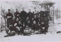 Photo of the students at the Hosptial Corps Training School in athetic gear taken near the well cover near the Northeast corner of grounds