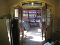 Ground Floor (Basement) - looking out south door at iron stairway - September 8, 2010