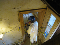 First Floor - Worker Sanding Door Frame Next to North Door - September 8, 2010