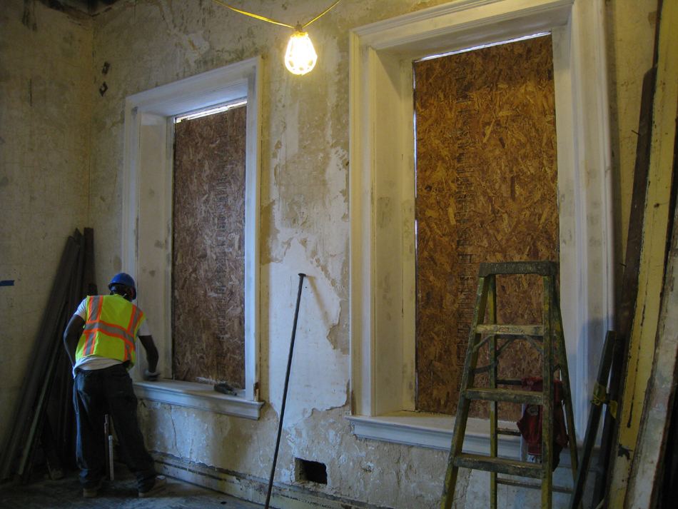 Second Floor--Priming window frames in southwest corner room