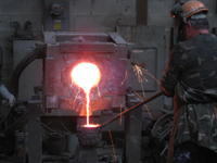 Fence -- Swiss Foundry -- pouring metal into molds for fence elements.