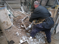 Fence -- Swiss Foundry -- extracting fence elements from cooling molds.