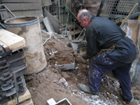 Fence -- Swiss Foundry -- extracting fence elements from cooling molds.