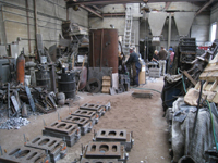 Fence -- Swiss Foundry -- view of foundry with newly poured molds in front - September 28, 2010