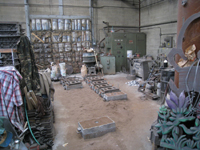 Fence -- Swiss Foundry -- view of foundry from other direction with newly poured molds in front - September 28, 2010