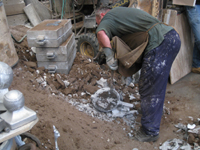 Fence -- Swiss Foundry -- extracting fence elements (here, circle) from cooling molds.