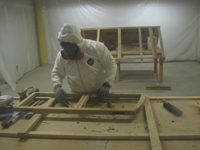 Windows and Doors - SRS Corp. -- window sashes being cleaned prior to repair and priming (work done in issolation room because of lead).