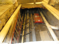 Ground Floor -- original brick chase for ventilation, located under the main corridor running east and west, now being used as a utility chase - September 28, 2010