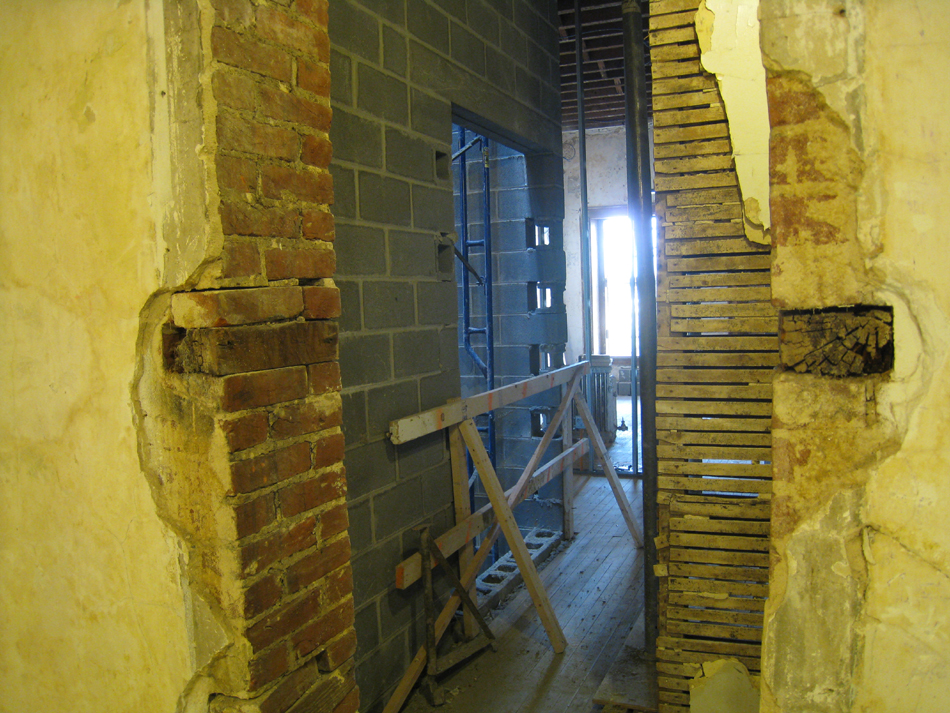 First Floor--From original staircase looking south west through to elevator shaft