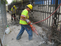 Fence--Removal of cement from bottom of fence on Pennsylvania Ave. side - October 19, 2010