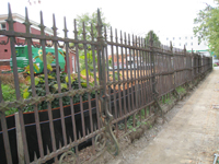 Fence--Removal of cement from bottom of fence on Pennsylvania Ave. side - October 19, 2010