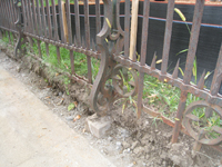 Fence--Detail--Removal of cement from bottom of fence on Pennsylvania Ave. side - October 19, 2010