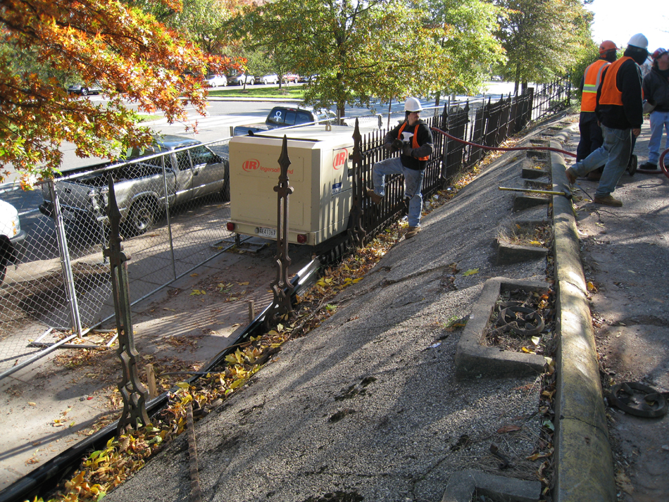 Fence--Removing fence section from Pennsylvania Ave. side for restoration