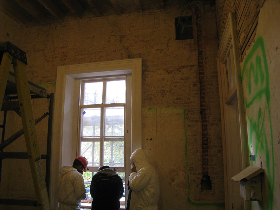 First Floor--Southeast room, bare brick on south wall