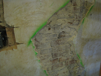 First Floor--Southeast room, detail of bare brick on north wall (by doorway) - November 3, 2010