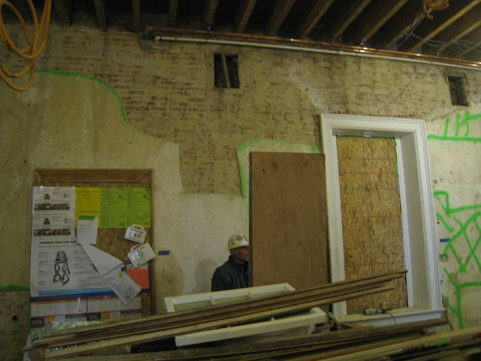 Second Floor--Northeast room--North wall.  Selective baring of wall for plaster replacement and restoration