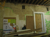 Second Floor--Northeast room--North wall.  Selective baring of wall for plaster replacement and restoration - November 5, 2010