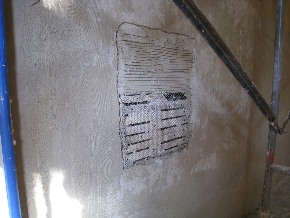 First Floor--Encapsulation step for new plaster in south east corner room, demonstration of layers