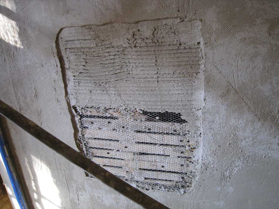 First Floor--Encapsulation step for new plaster in south east corner room, demonstration of layers