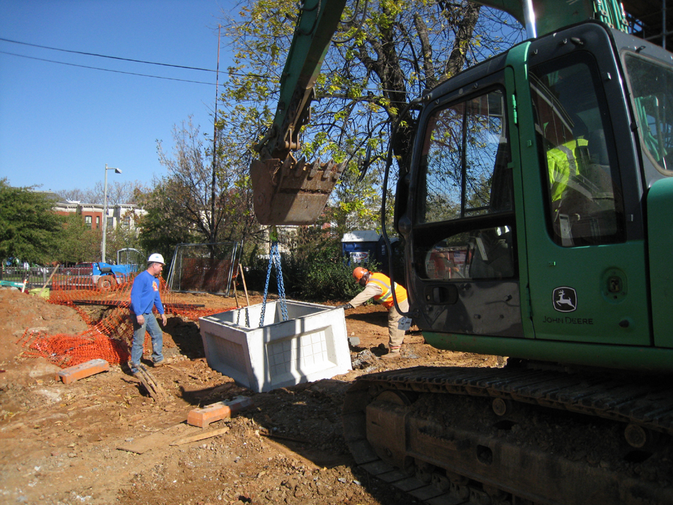 Geothermal/HVAC--Lowering vault sections into place