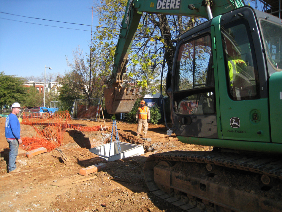 Geothermal/HVAC--Lowering vault sections into place