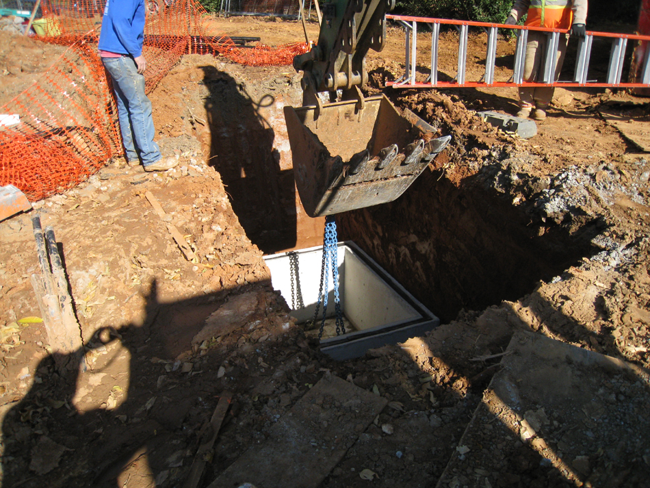 Geothermal/HVAC--Lowering vault sections into place