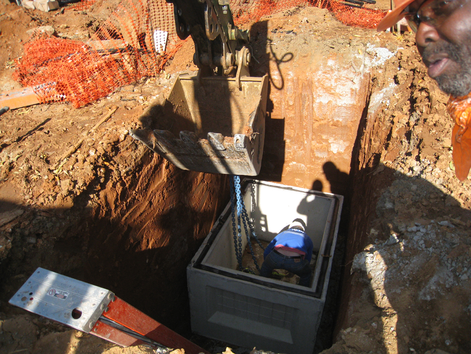 Geothermal/HVAC--Lowering vault sections into place