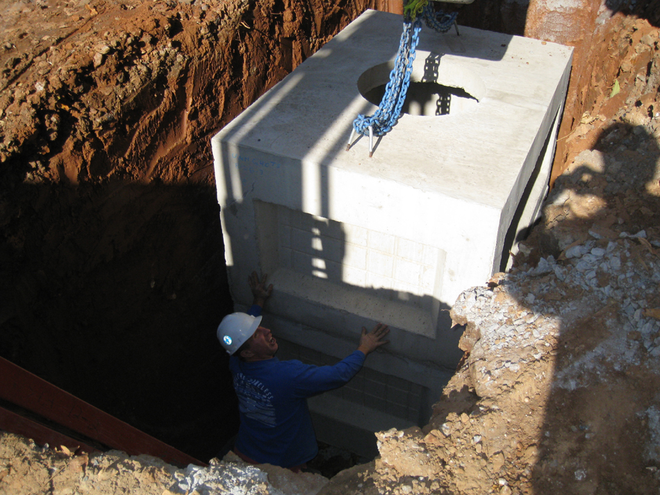 Geothermal/HVAC--Lowering vault sections into place