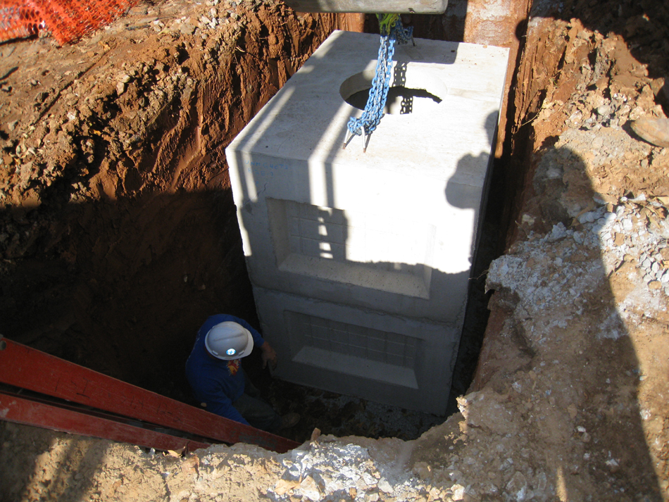 Geothermal/HVAC--Lowering vault sections into place