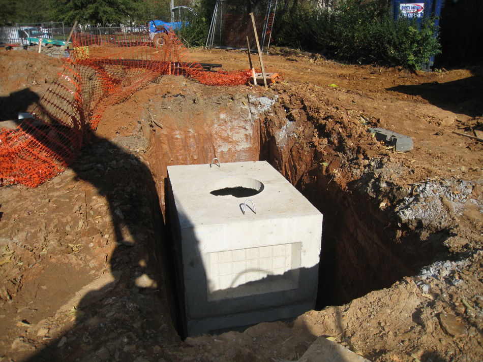 Geothermal/HVAC--Lowering vault sections into place