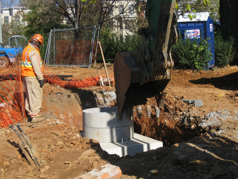 Geothermal/HVAC--Lowering vault sections into place