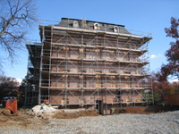 Elevation--East side after paint removal.  Worker preparing mortar joints for repointing - November 17, 2010