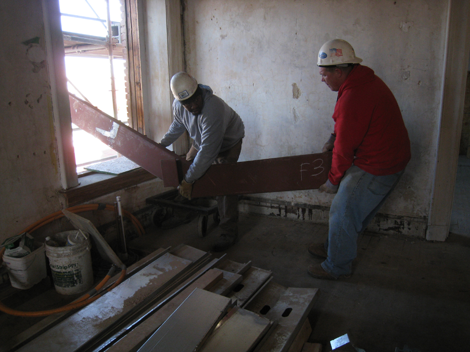 Second Floor--Lifting the parts for the east staircase into the building (through the west side corridor window)