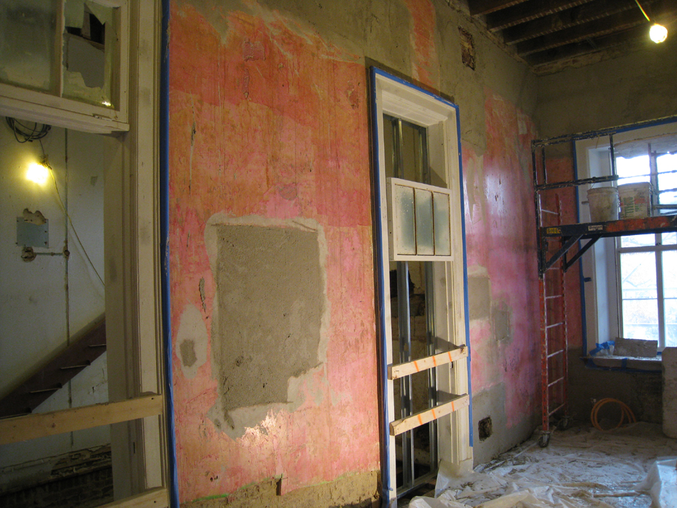 First Floor--Central east room on south side being prepared for brown (encapsulating) coat (note east stairway under construction).