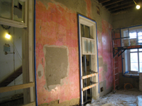 First Floor--Central east room on south side being  prepared for brown (encapsulating) coat (note east stairway under construction). - December 2, 2010