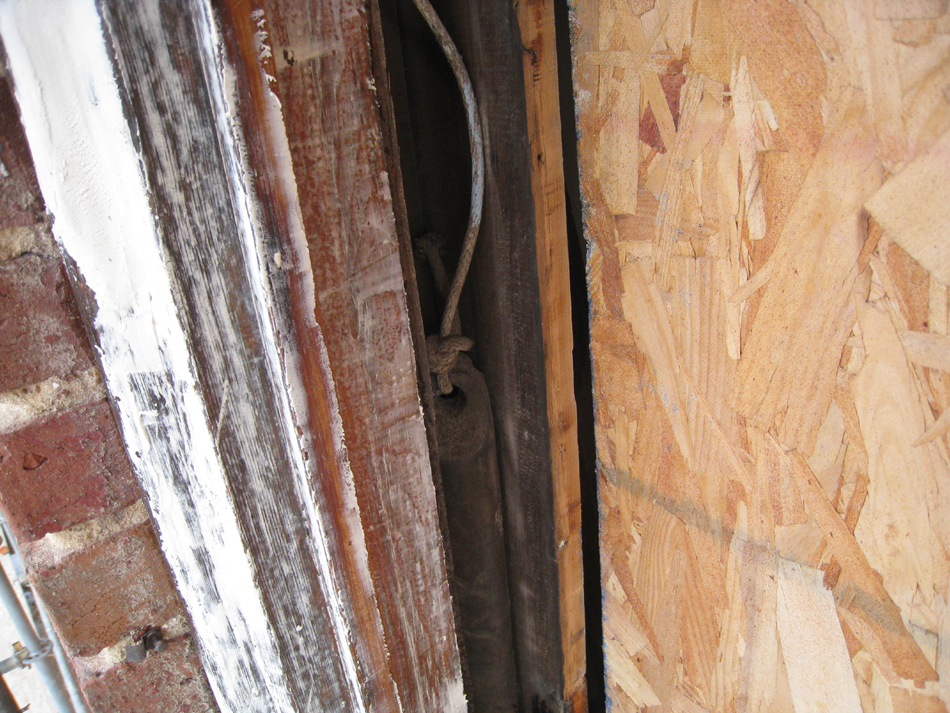 Elevation--West side, first floor, detail of restored window frames before priming