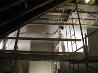 Second Floor--Applying final plaster coat in central stairwell - January 7, 2011