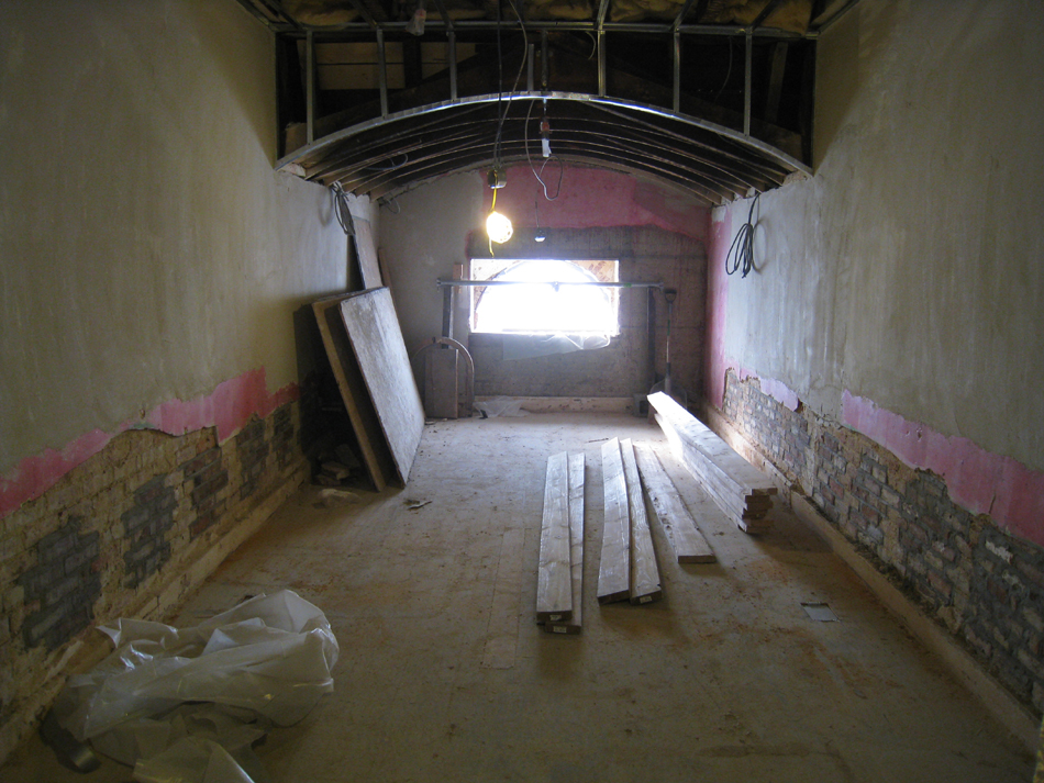 Third Floor--Central room with exposed brick (where bracing was for second floor walls) - January 20, 2011