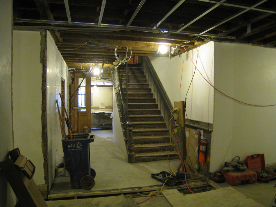 Ground Floor--New concrete floors and plaster in corridor looking north towards north exit - February 1, 2011