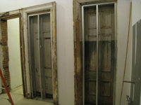 Second Floor--Northwest central room (west bathroom), behind elevator, showing old doors which will be enclosed - February 1, 2011