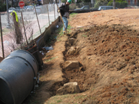 Fence--Exposing the granite footings for the fence - March 14, 2011