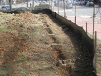 Fence--Exposing the granite footings for the fence - March 14, 2011