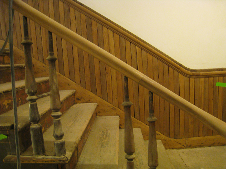 Second Floor--Sanded railing for the central staircase (note the two alternating woods in the chair rail) - March 14, 2011