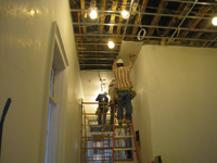 Second Floor--Corridor looking west--Installing drywall on ceiling - March 15, 2011