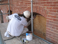 Elevation--Final painting touches for west side, ground floor window frames - March 18, 2011