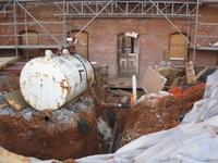 Elevation--West side, showing geothermal pipes entering building under what will become the main entrance - March 18, 2011