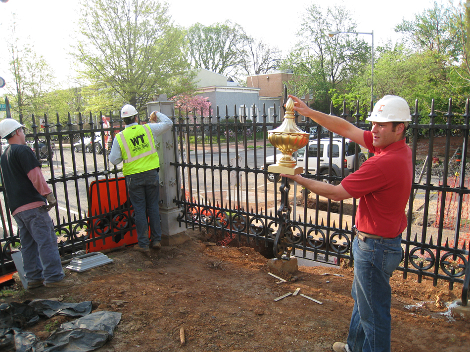 Fence--Looking out toward the corner of Tenth and E Streets SE. Erik Krupp with model of corner piece - April 20, 2011