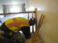 Third Floor--Setting spindles in stair railing - April 29, 2011