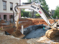 Grounds--Rain garden base--filter cloth over gravel, to be filled with three feet of soil then planted - May 23, 2011