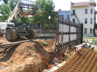 Fence--West fence being installed at south west corner - June 2, 2011